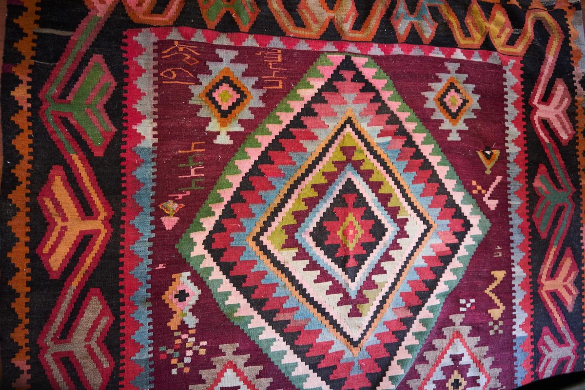 Garen Karnikian’s Armenian carpet from 1963, with several women’s names weaved in it in Armenian. (Lindsey Hoang / Xpress Magazine)